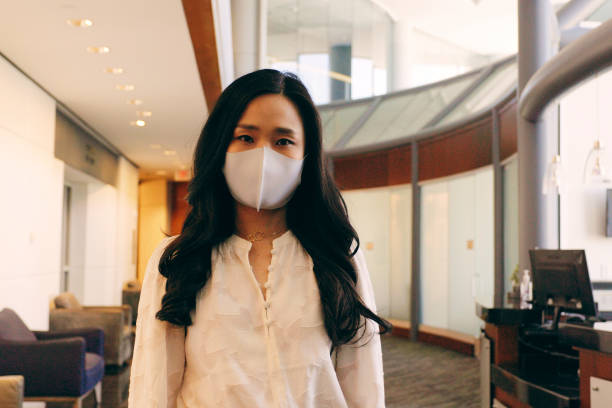 istock Business Person Taking of a Protective Facemask 1314049843