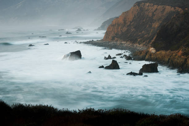istock Long Exposure Of Ocean Waves Crashing On Shore 1314049889