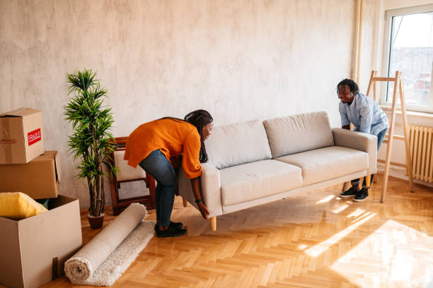 istock Young couple placing sofa in new home 1314050540