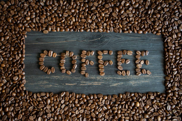istock Coffee beans form a word on a coffee beans background 1314050561