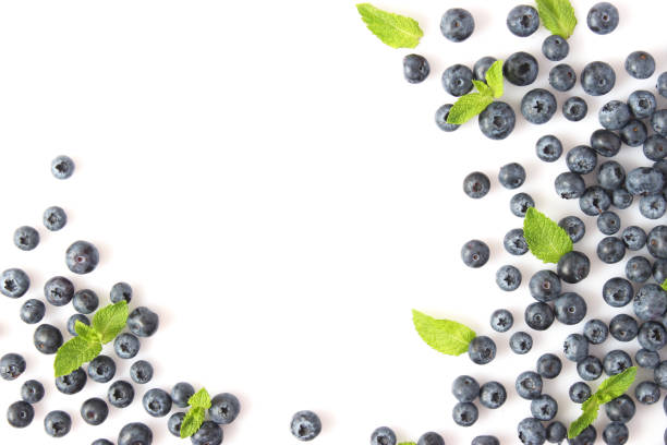 istock blueberry and mint leaves on a white background top view. Place for text 1314052018