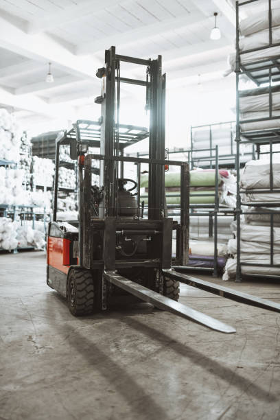 istock Expert Forklift Driver Carrying Load Of materials In Warehouse 1314052122