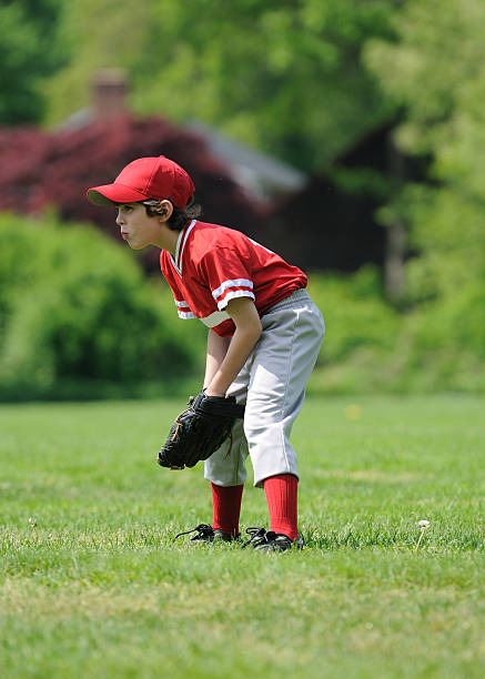 outfielder youth league boy doesnt get any more american pastime then a little league player full of love for the game outfield stock pictures, royalty-free photos & images