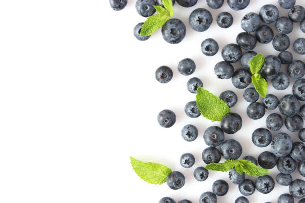 istock blueberry and mint leaves on a white background top view. Place for text 1314055661