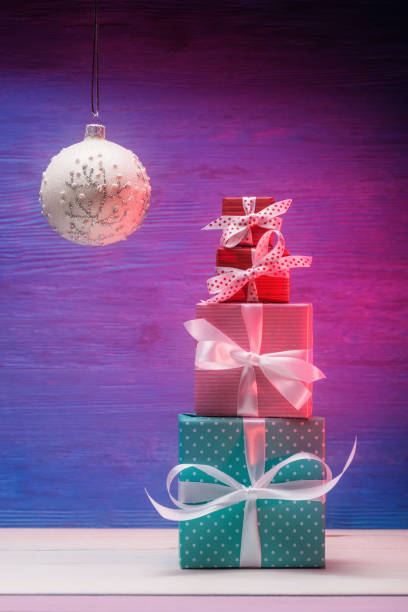istock Stack of various gift boxes and Christmas ball. Xmas and New Year concept 1314055820