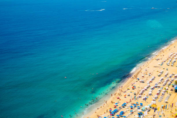 istock Beach with people on the sea top view 1314058547