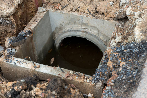 istock Concrete circular run-off pipe discharging water. sewage pipe polluting the river. Sewage or domestic wastewater or municipal wastewater that is product by community of people. 1314059614