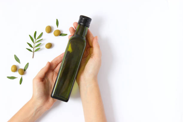 istock olive oil in a bottle on a white background top view. 1314060747
