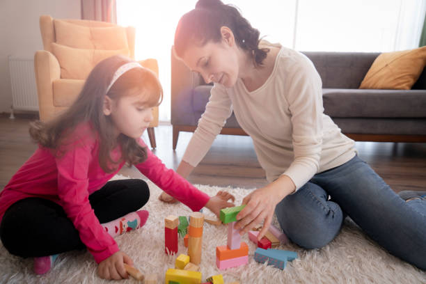 istock Mother and Daughter playing together 1314061490
