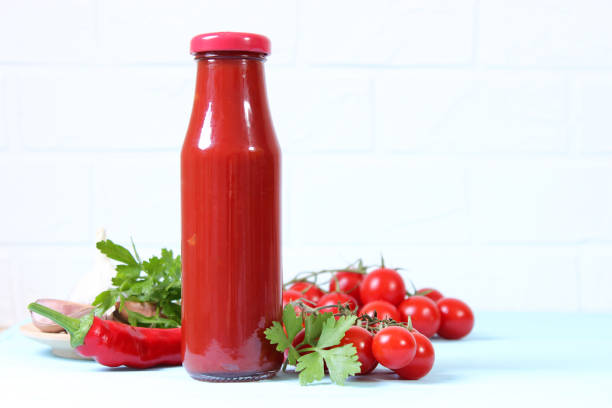 istock Ketchup on the table. Tomato sauce, fresh tomatoes. 1314063934
