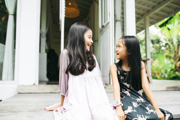 istock two kids talking and playing at home 1314064220