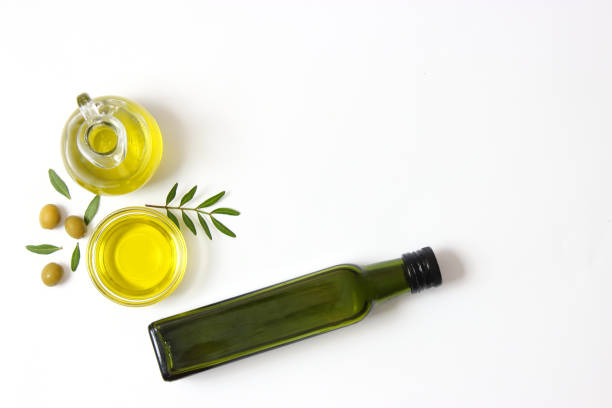 istock olive oil in a bottle on a white background top view. 1314064455