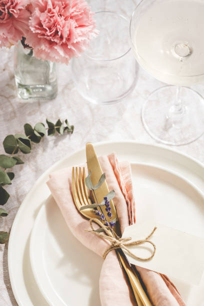 istock Overhead view on table setting with golden cutlery. 1314067116