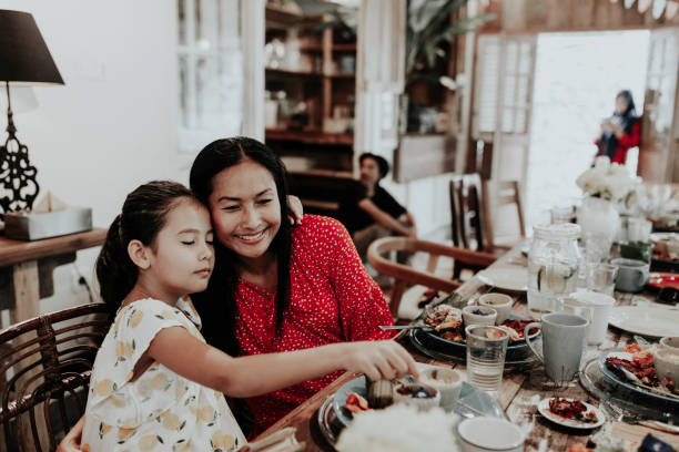 istock Mom & child having meal in restaurant 1314069165