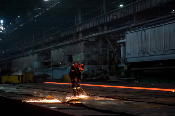 istock Worker doing a industrial welding at a steel mill 1314070611