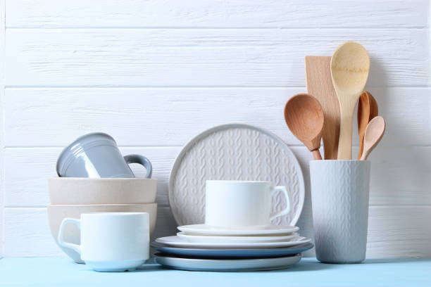 istock A set of dishes and kitchen utensils on a colored background. 1314071819
