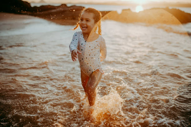istock Child on a lively day at the beach 1314073177