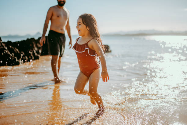 istock Child on a lively day at the beach 1314073204