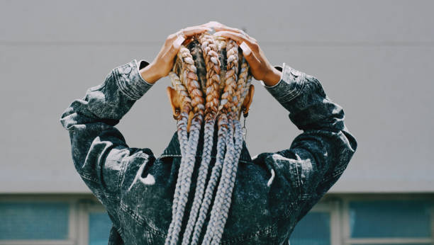 istock Rearview shot of a woman with cornrows posing outside 1314073914