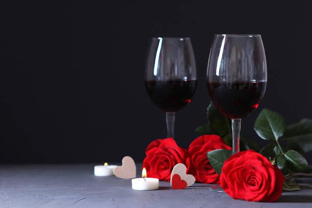 istock red wine and roses on the table. Valentine's day background. 1314075117