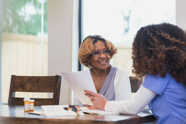 istock Nurse discusses medical history with patient 1314076201