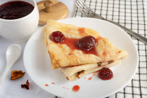 istock Pancakes with strawberry jam on a white plate 1314076310