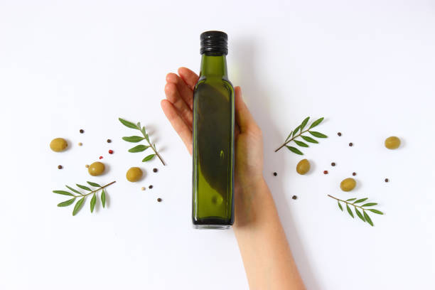 istock olive oil in a bottle on a white background top view. 1314077738