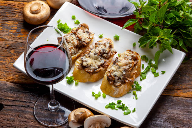 Mushroom bruschetta and grated parmesan and red wine