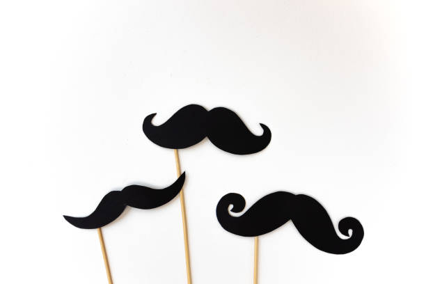istock black mustaches on white background, happy father day 1314079662