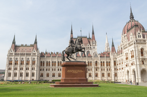 Budapest, Hungary - 1st September 2022: Rakoczi Ferenc equestrian statue in front of the Hungarian Parliament Building in Budapest