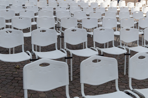 lined meeting chairs at outdoor activity