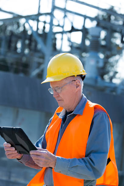 istock Senior Engineer looking and checking electric power station. 1314084887