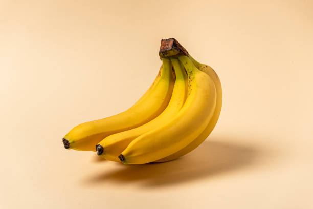 istock banana cluster isolated, on beige background 1314085244