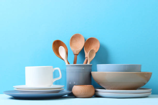 istock A set of dishes and kitchen utensils on a colored background. 1314091479