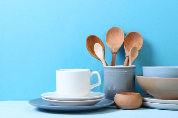 istock A set of dishes and kitchen utensils on a colored background. 1314092032