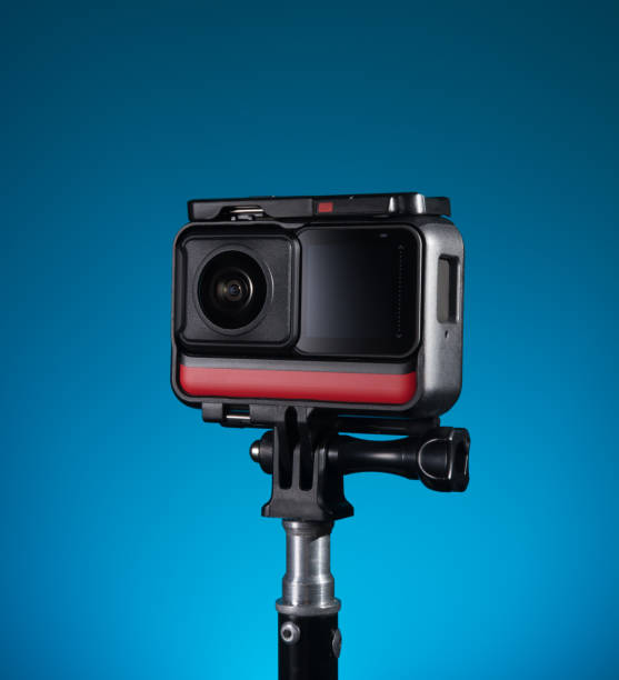 istock 360 degree panoramic action camera on a tripod. blue background 1314092916