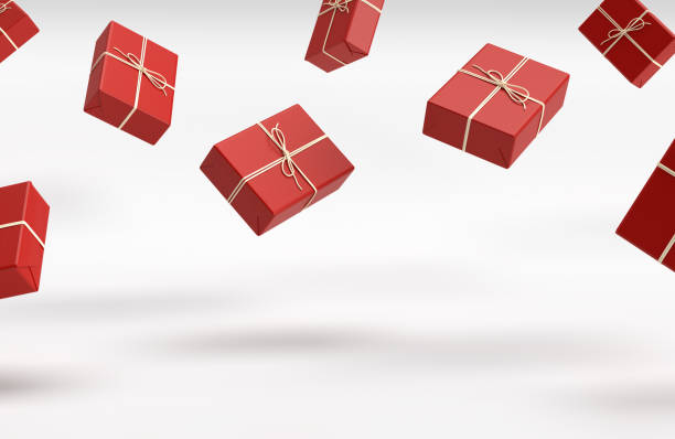 Red presents gifts or packages falling white background stock photo