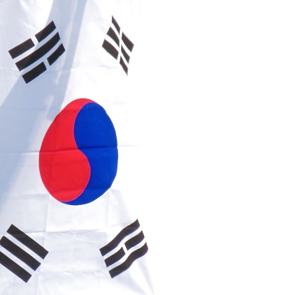 Flag of South Korea waving in the wind giving an undulating texture of folds in the fabric. The Image is in the official ratio of the flag - 2:3.
