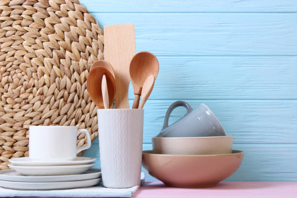 istock A set of dishes and kitchen utensils on a colored background. 1314093856