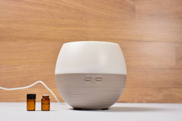 istock diffuser for essential oils. and two small glass jars of oil. treatment and prevention concept. 1314094827