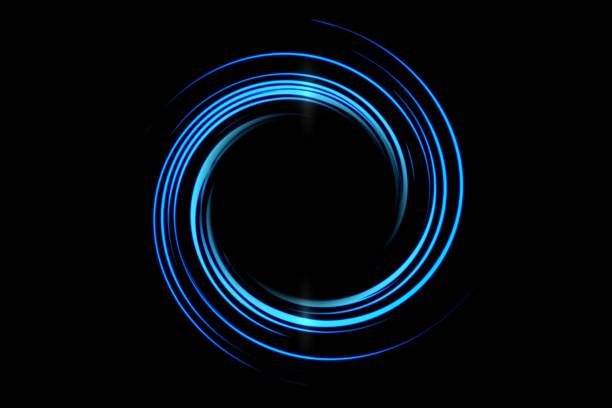 istock Glowing blue spiral tunnel with effect light line on black background 1314096469