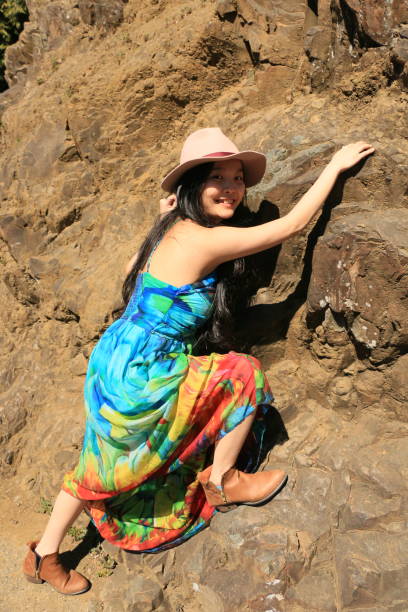 istock Woman Climbing a Rock 1314096661