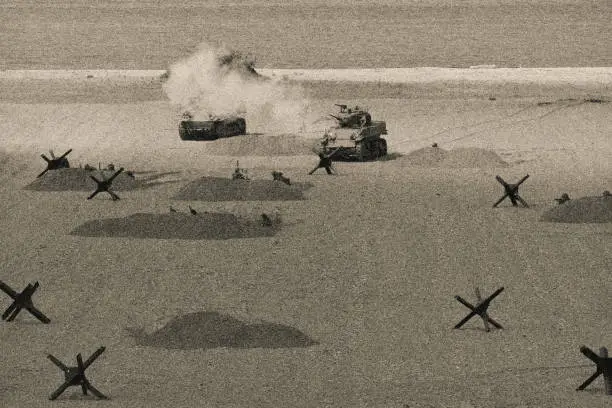World War 2  Tank Firing Weapon on Battle Field. Omaha Beach. Normandy invasion