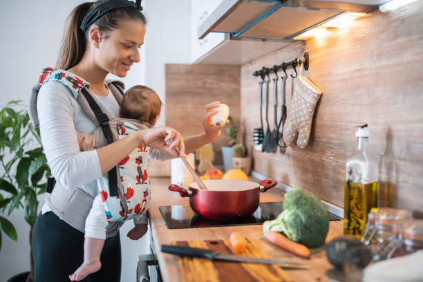 istock Mother cooking together with her baby. 1314098709