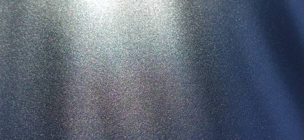 istock blurred striped dark black and blue background. Play of light and shadow. Light rays. Divine or heavenly radiance from above. Simulate lighting something from above with spotlights. Copy space 1314098743