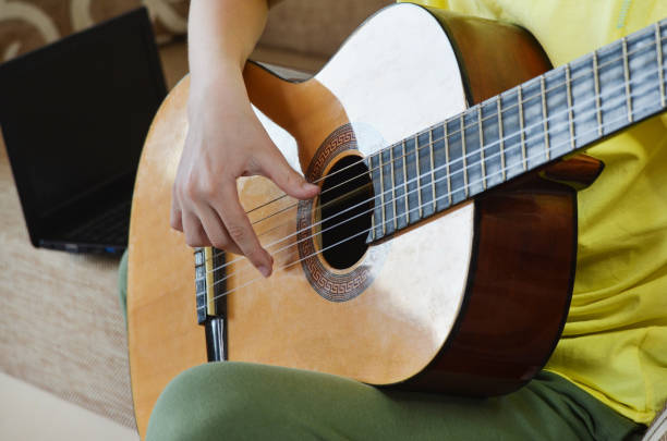 istock teenager playing guitar 1314101580
