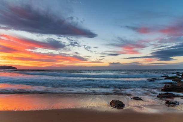 istock Sunrise at the seaside with pastel coloured clouds 1314102289