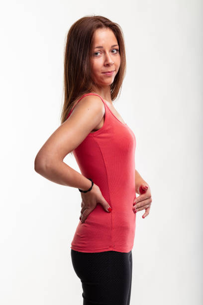 istock Slender fit toned young woman in a side view isolated on white 1314103407