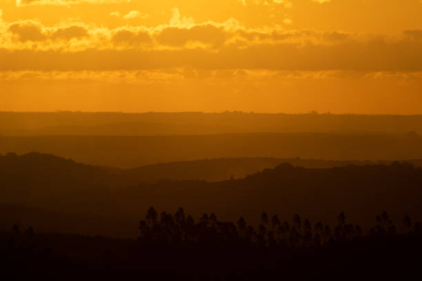 istock Sunset illuminating the horizon mountains with golden hour 1314111301