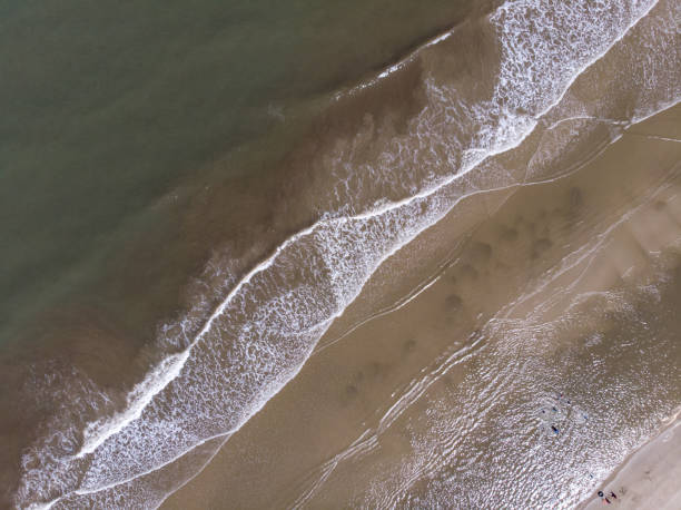 istock Aerial drone image view of ocean waves crashing on beach 1314116595